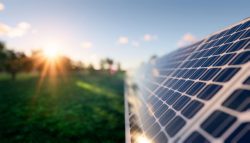 row solar panel in green field-greenbusiness